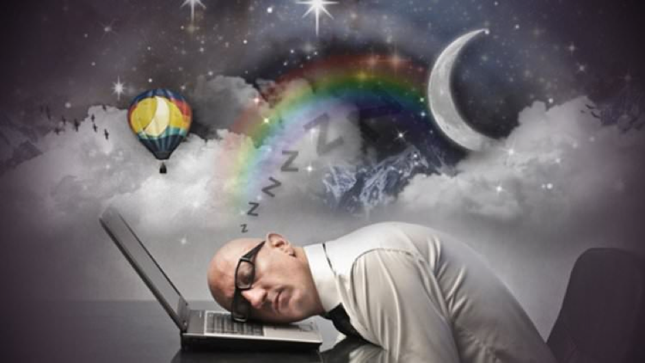 man sleeping with dreams of rainbows, moons and hot air balloons 