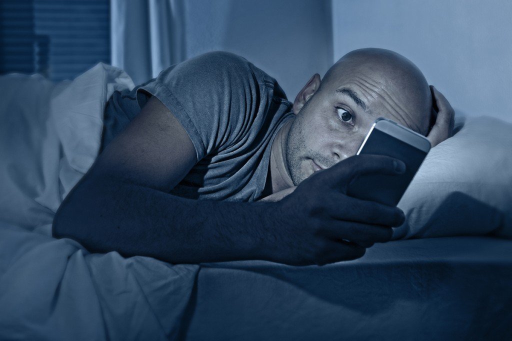 man on his phone at night